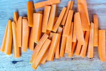 Closeup of fresh organic carrots sliced on the table.