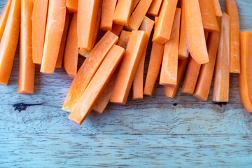 Closeup of fresh organic carrots sliced on the table.