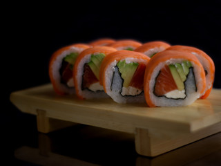 sushi on plate with chopsticks