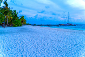 Yacht near the pier of a fabulous island in the Maldives.