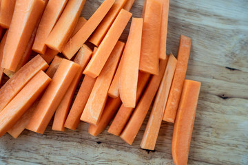 Closeup of fresh organic carrots sliced on the table.