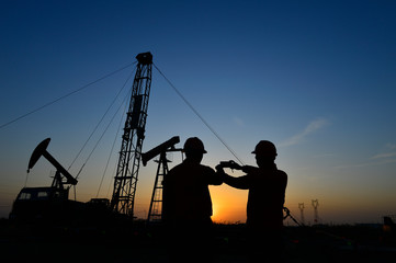Fototapeta na wymiar The oil workers in the job