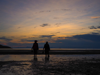 Silhouette of two islander at Tropical sea , Koh yao , Thailand