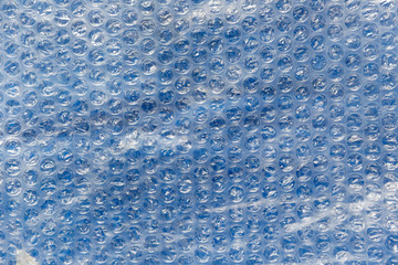 Blue & clear bubblewrap textured surface ready to pop.
