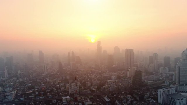 4K aerial drone footage of Bangkok skyline, Great sunset scene. Business city, view of Bangkok downtown, Flying over Bangkok, Thailand.