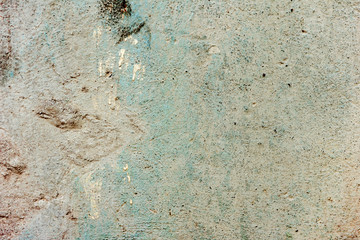 Texture of a concrete wall with cracks and scratches which can be used as a background