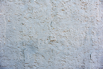 Texture of a concrete wall with cracks and scratches which can be used as a background