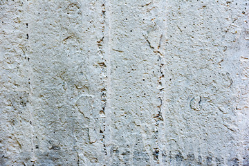 Texture of a concrete wall with cracks and scratches which can be used as a background