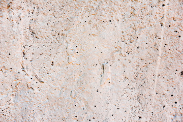 Texture of a concrete wall with cracks and scratches which can be used as a background