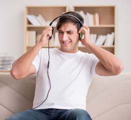 Man listening to music at home