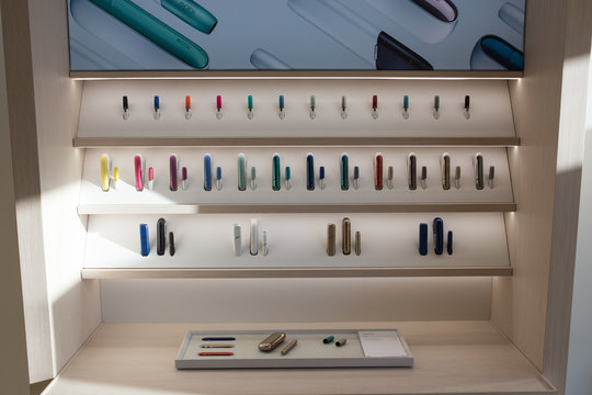 New design IQOS. Showcase with a large multi-colored selection.