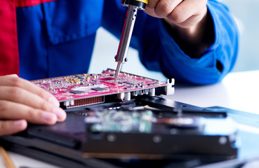 Repairman working in technical support fixing computer laptop tr