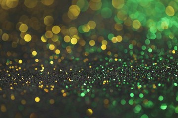 Wallpaper phone shining glitter.New Year and Christmas  background. Gold and green glitter macro...