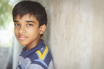 Portrait of Indian boy posing to camera