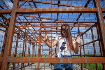 the girl is locked in a cage