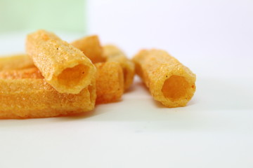 closeup shot of crispy fried roll pappad snacks with white background