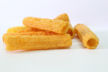 closeup shot of crispy fried roll pappad snacks with white background