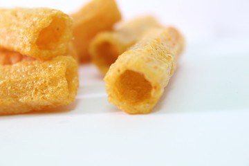 closeup shot of crispy fried roll pappad snacks with white background