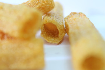 closeup shot of crispy fried roll pappad snacks with white background
