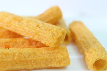 closeup shot of crispy fried roll pappad snacks with white background