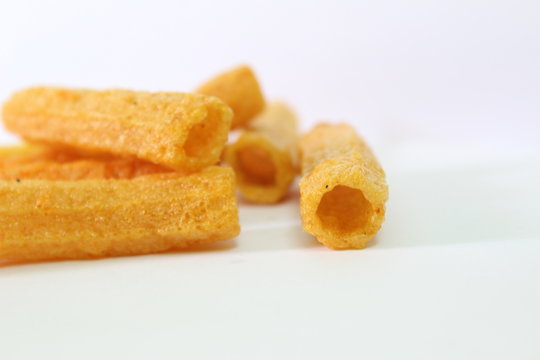 closeup shot of crispy fried roll pappad snacks with white background