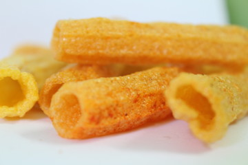 closeup shot of crispy fried roll pappad snacks with white background