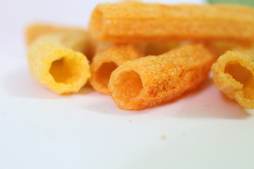 closeup shot of crispy fried roll pappad snacks with white background