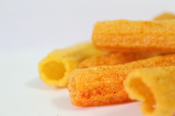 closeup shot of crispy fried roll pappad snacks with white background