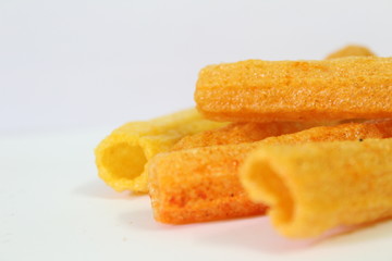 closeup shot of crispy fried roll pappad snacks with white background