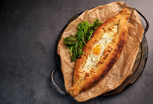 delicious Adjarian khachapuri with greens