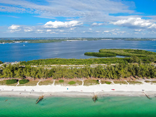 Obraz premium Aerial view of Anna Maria Island, white sand beaches and blue water, barrier island on Florida Gulf Coast. Manatee County. USA