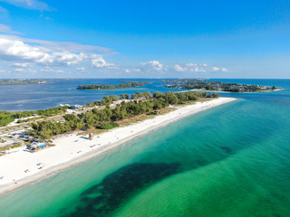 Aerial view of Anna Maria Island, white sand beaches and blue water, barrier island on Florida Gulf Coast. Manatee County. USA