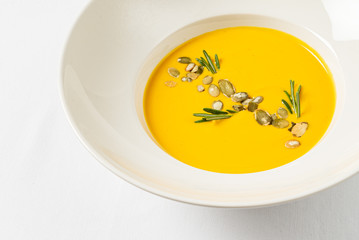 pumpkin cream soup on the white background