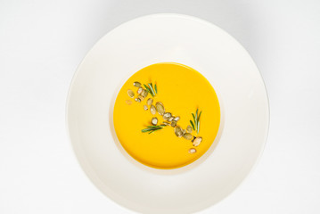 pumpkin cream soup on the white background