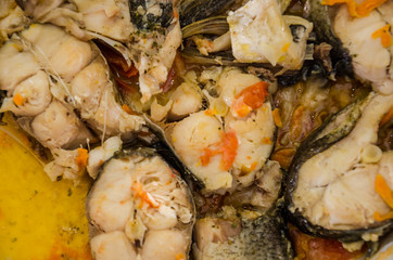 fried fish in a pan, close-up.