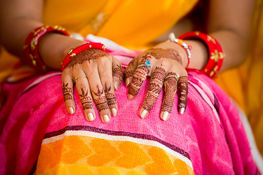 Closeup of Indian bridal mehndi henna hands, wedding Ceremony.