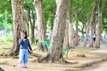 Little Child Girl Very Happy and Smile at The Public Park