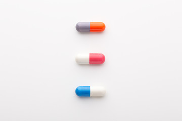 Medical capsule pills on white background