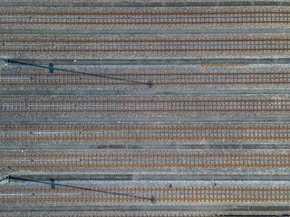 Aerial view of freight train wagons on large railway track field. Concept of modern logistics.