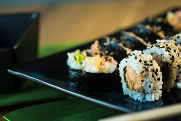 Japanese sushi set. Maki and rolls with tuna, salmon, shrimp, mango, crab and avocado