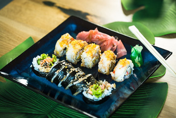 Japanese sushi set. Maki and rolls with tuna, salmon, shrimp, mango, crab and avocado