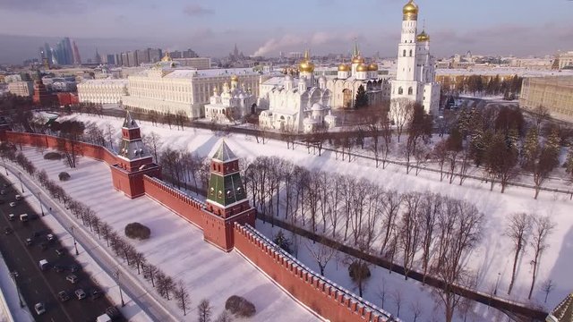 Winter Moscow kremlin wall churches aerial forward flight. Unique bright sun snow covered capital city. Travel tourism sight. Best of Russian glory cinematic footages