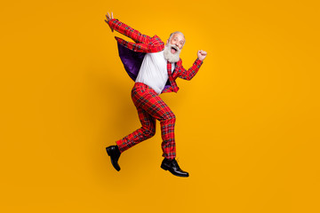 Full length body size view of his he nice handsome cheerful cheery funky comic playful overjoyed gray-haired man jumping running isolated over bright vivid shine vibrant yellow color background
