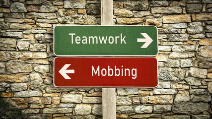 Street Sign to Teamwork versus Mobbing