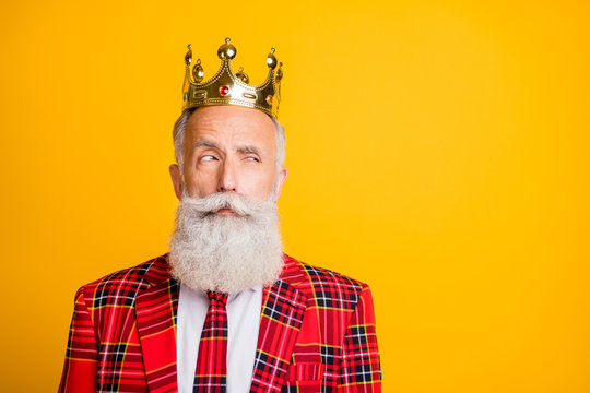 Close-up Portrait Of His He Nice Handsome Attractive Serious Arrogant Proud Suspicious Gray-haired Man Wearing Crown Looking Aside Isolated Over Bright Vivid Shine Vibrant Yellow Color Background