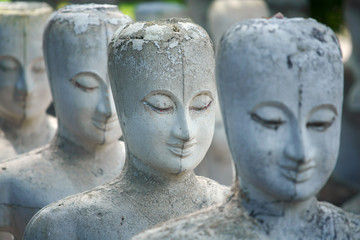 row of unfinished buddha statue background
