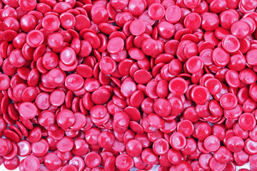 abstract of red industrial plastic pellets background