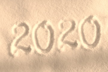 Abstract Christmas photo for beautiful Christmas card with background inscription 2020 on real white snow in winter in cold weather