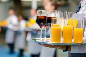 Waiters serving drinks in cocktail