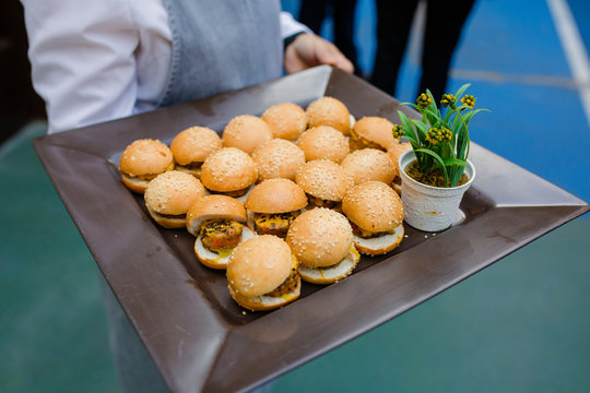 Waiter serving food in cocktail